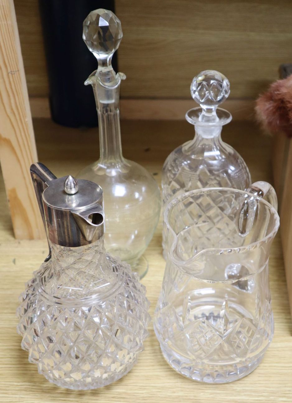 An early 20th century Australian white metal mounted glass claret jug, by Brunkhorst of Adelaide, glass water jug, decanter and carafe